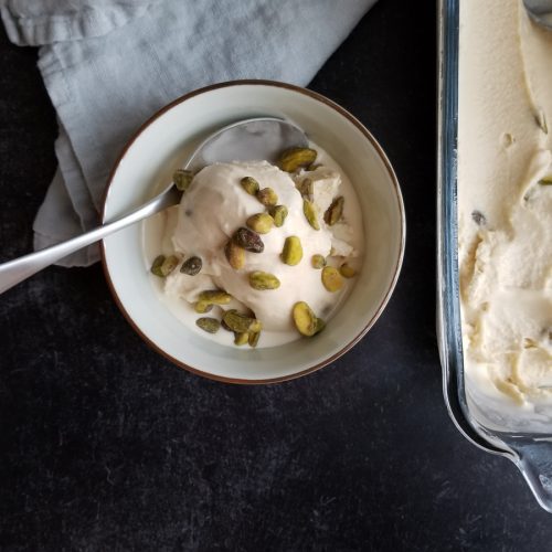 Honey Ice Cream with Pistachios in bowl with spoon