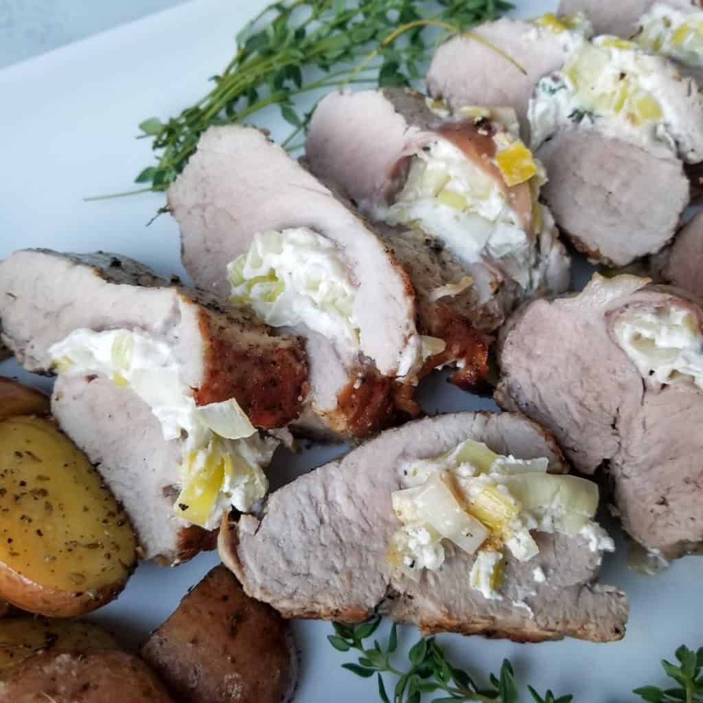 Pork Tenderloin Stuffed with Goat Cheese, Leeks and Prosciutto