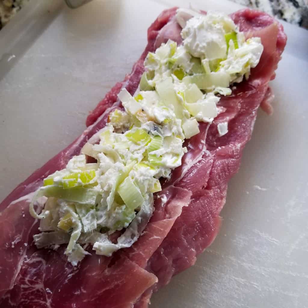 Pork Tenderloin Stuffed with Goat Cheese, Leeks and Prosciutto - ingredients on cutting board